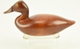 Lot #757 -R. Keene Mahogany natural finish miniature decoy with painted eyes (from the Mort