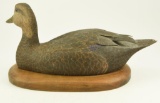 Lot #781 - 1981 Neal Conoley Blackduck Decorative decoy with raised tail feathers. On wood