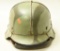 Lot #1139 - Military helmet with SS decal. Has a liner and chin strap. Comes with belt and  buc