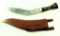 Lot #1433 - Gurkha knife in leather sheath. Knife measures 19 1/4“ overall.