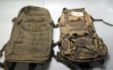 Lot #1097 - (2) Military tactical assault rucksack backpacks. Dessert camo example is  still in