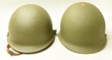 Lot #1140 - (2) Military helmets. One has liner and chin strap.