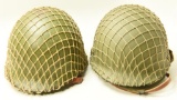 Lot #1143 - (2) US Military helmets with netting and liners.