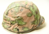 Lot #1145 - WWII style military helmet with interior liner and exterior camouflage