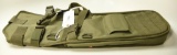 Lot #1281 - Olive drab nylon pistol grip shot gun backpack bag w/ molle webbing.