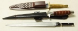 Lot #1296 - (2) Stiletto knives in sheaths. One marked STAINLESS PAKISTAN, the other  marked VA