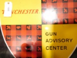 Lot #1502 - Older Winchester Gun Advisory Center metal sign. Has a diameter of 38“. A couple  o