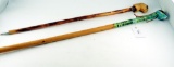 Lot #1576 - (2) Carved wood walking sticks including one with eagle handle with label  reading