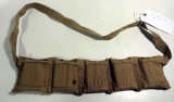 Lot #879 - Military ammo belt with 50 rounds of .303 British cartridges. Belt marked