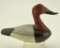 Lot # 4733 - Small Carved Canvasback Drake decoy Branded M. B. on underside 5”
