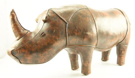 Lot # 4089 - Leather rhino footstool made for Abercrombie & Fitch. Measures 35” in length and