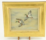 Lot # 4373 - Oil painting on canvas of mallard ducks in flight signed by artist SCHUMAN. Has