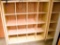 Lot #1270 - Contemporary natural finish 16 compartment storage case/bookcase (59” x 59” x 17”)