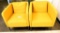 Lot #1414 - Pair of Ikea of Sweden mustard yellow upholstered bucket chairs (29” x 28” x 28”)