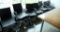 Lot #1452 - (7) Commercial black vinyl and chrome office chairs (as is all have wear to vinyl