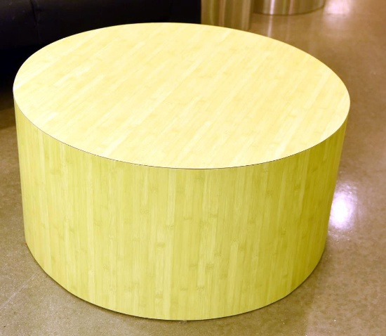 Lot #1254 - Contemporary cylinder cocktail table in limed oak finish (36” x 18”)