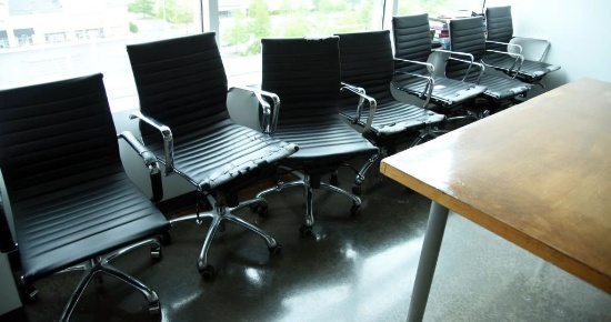 Lot #1452 - (7) Commercial black vinyl and chrome office chairs (as is all have wear to vinyl