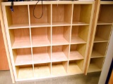 Lot #1270 - Contemporary natural finish 16 compartment storage case/bookcase (59” x 59” x 17”)