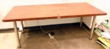 Lot #1411 - Door converted to work table with gray gun metal legs (30” x 79” x 36”)