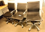 Lot #1421 - (3) Commercial grade black vinyl and chrome adjustable office chairs (wear to vinyl