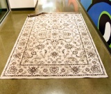 Lot #1496 - Floral machined black and white area rug (60”x85