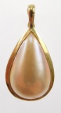 Lot #3: 14k yellow gold ladies’ enhancer , containing a bezel set pear shape Mabe' pearl