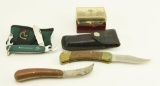 Lot #24 - Buck model 110 knife in leather sheath, Tina German folding skinning knife, Ducks