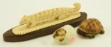 Lot #296 - (2) Miniature carved turtles and one bone carving on wood