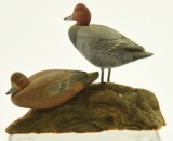 Lot #452 - Pair of miniature carved standing full body Redheads on driftwood base signed A.J.