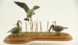 Lot #440 - Superb miniature carved Canada Geese habitat display by M.L. Carey, Cotton Patch, DE