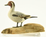 Lot #461 - W. Reinbold miniature carved full body standing Pintail drake on driftwood signed on
