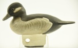 Lot #474 - Carved Bufflehead Hen decoy with wooden keel and 1993 US Penny inlaid into bottom of