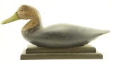 Lot #498 - New Jersey Black duck decoy on stand. Head and repaint by John Updike 16 ½” A51.123