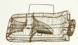 Lot #576 - Primitive springwire varmint trap with carry handle late 1800’s 15” x 9”