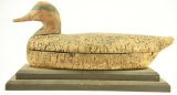 Lot #626 - Early Cork Body Widgeon drake decoy with lots of gunning wear on wooden stand. Used