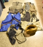 Entire tote full of shooting vests, skeet vests,
