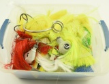 Tote of deep trolling spoons and weighted mojo
