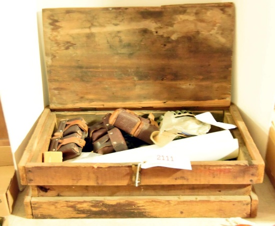Lot #2111 - Vintage wooden crate full of ammo belts, clips, vintage military belts, shooting co