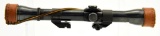 Lot #2089 - J.C. Higgins 4x Rifle Scope with Weaver mounts and leather scope caps