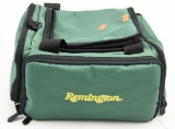 Lot #2254 - Remington soft sided zippered range bag full of gun cleaning supplies