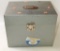 Tin full of miscellaneous shooting supplies including Pachmyre pistol grips, (2) boxes of
