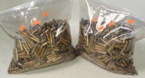 (2) bags approximately 20lbs worth of .223 and 5.56mm brass shell casings (casings only)