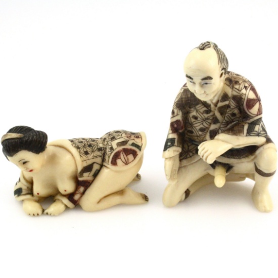 Pair of pornographic resin Chinese figurines