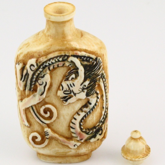 Vintage genuine hand-carved ivory perfume or snuff bottle with dragon design