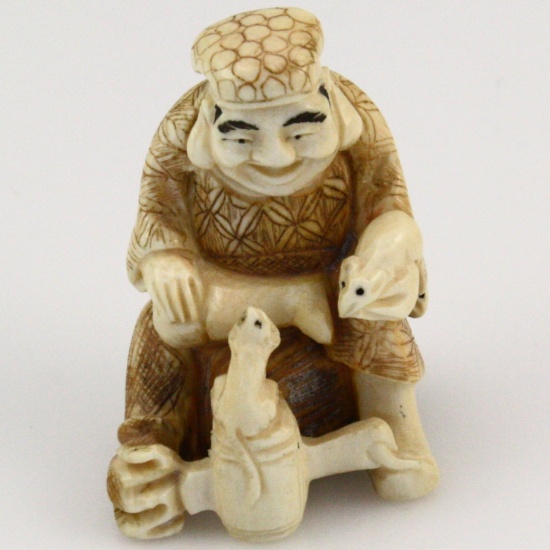 Vintage genuine hand-carved signed ivory Chinese man stabbing a demon's head figurine