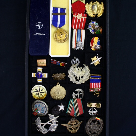 Collection of 18 Soviet-era pins, badges & medals