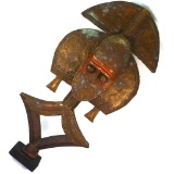 Vintage African reliquary hammered copper-over-wood Lakota sculpture on a wooden base