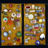 Collection of ~73 international pins in a leather folder