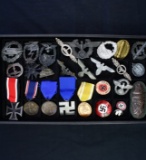 Collection of 27 reproduction Nazi pins, badges & medals