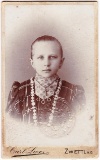 Embossed 1912 Austria identification card of a young girl in traditional dress